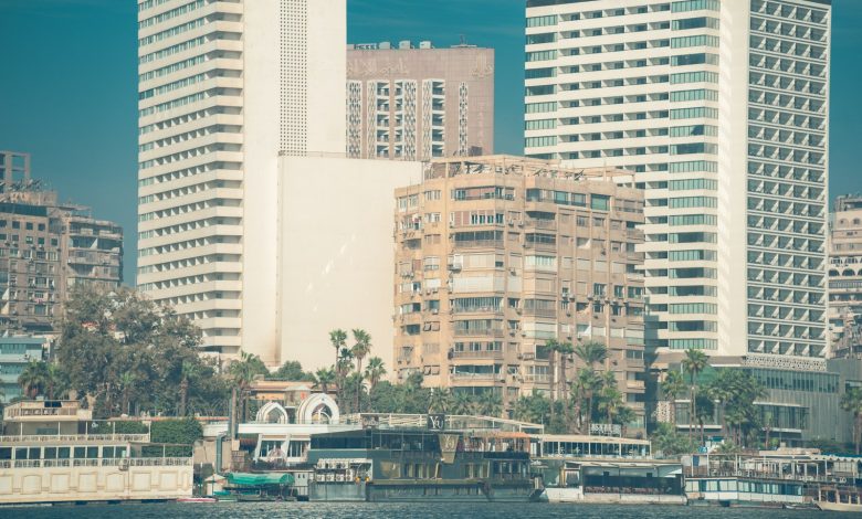 Modern buildings and boats along the Nile in Cairo.