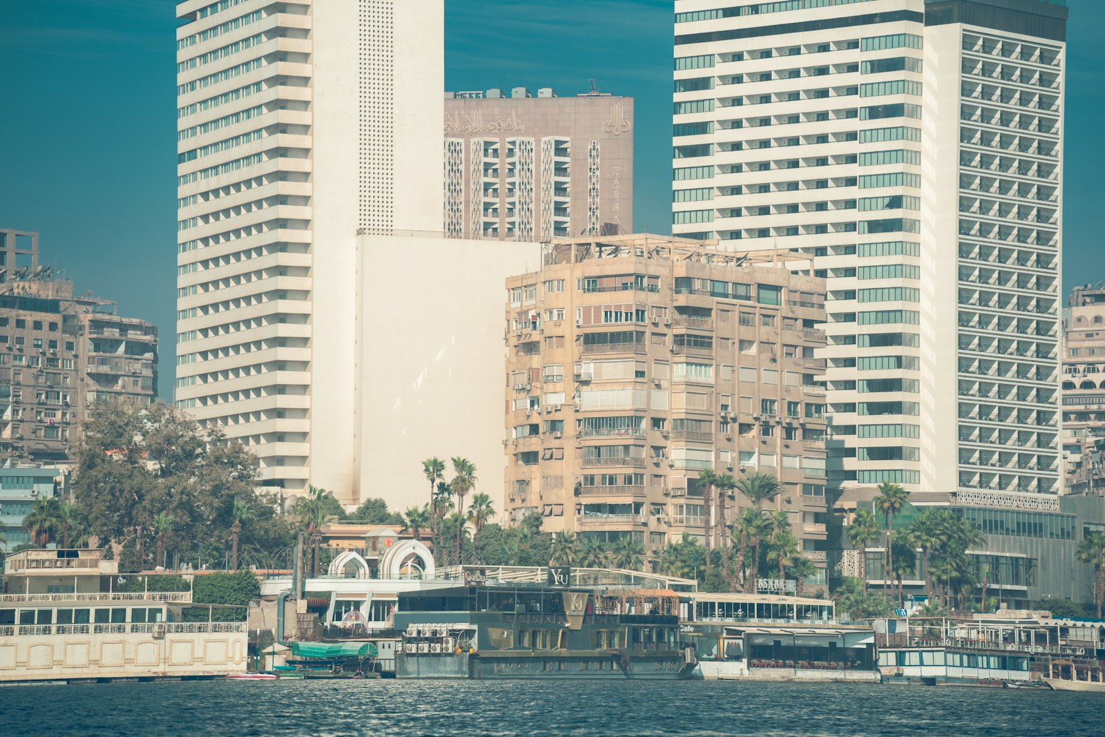 Modern buildings and boats along the Nile in Cairo.