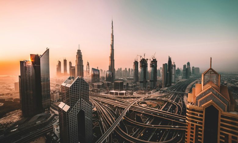 Downtown Dubai skyline and Burj Khalifa at sunrise.