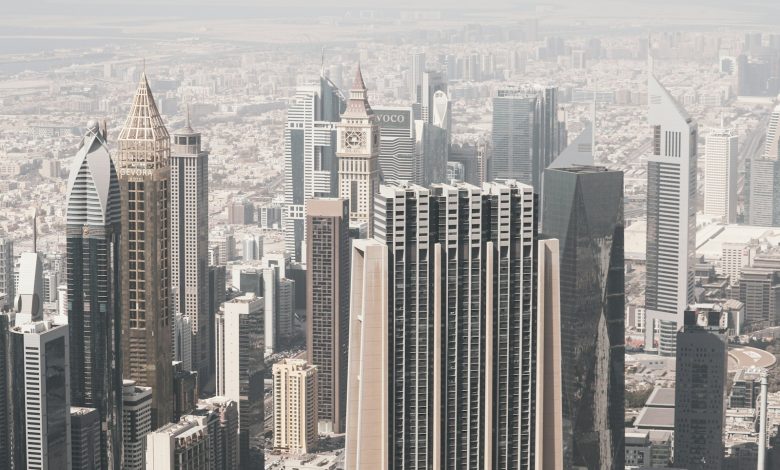 Dubai financial district skyline in hazy daylight.