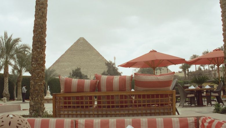 A hospitality terrace overlooking a pyramid illustrating Egypt’s luxury tourism and experience-design opportunity
