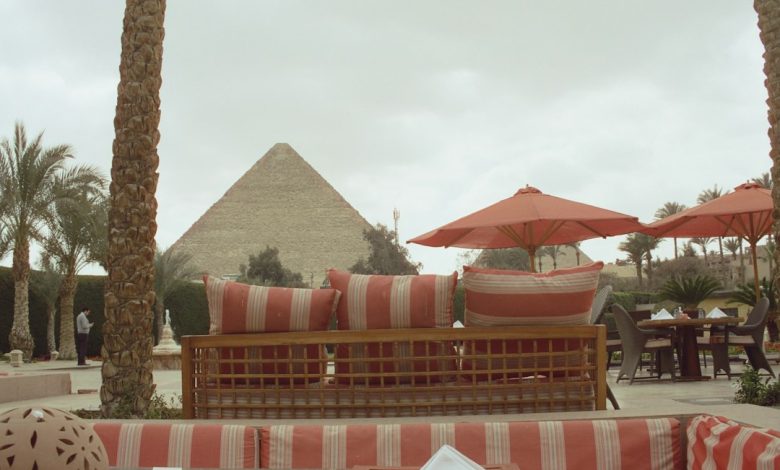 A hospitality terrace overlooking a pyramid illustrating Egypt’s luxury tourism and experience-design opportunity