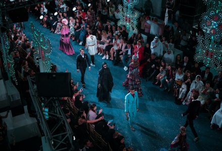 Models presenting a collection on a fashion runway
