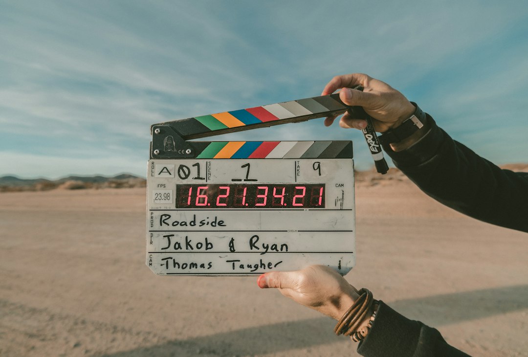 Film clapperboard held in front of a camera crew