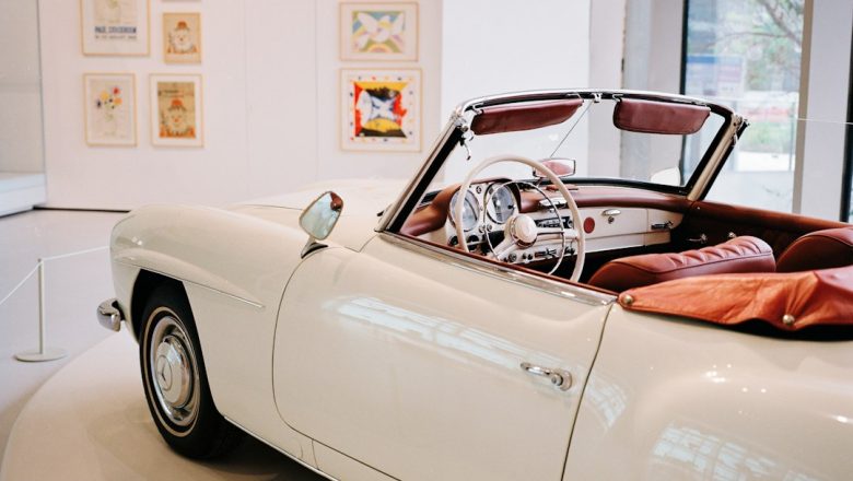 A classic luxury car displayed in a museum setting illustrating Qatar’s automotive culture