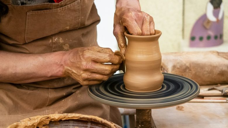Hands shaping clay on a pottery wheel illustrating Tunisia’s women-led craft and design economy
