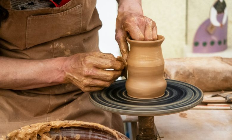 Hands shaping clay on a pottery wheel illustrating Tunisia’s women-led craft and design economy